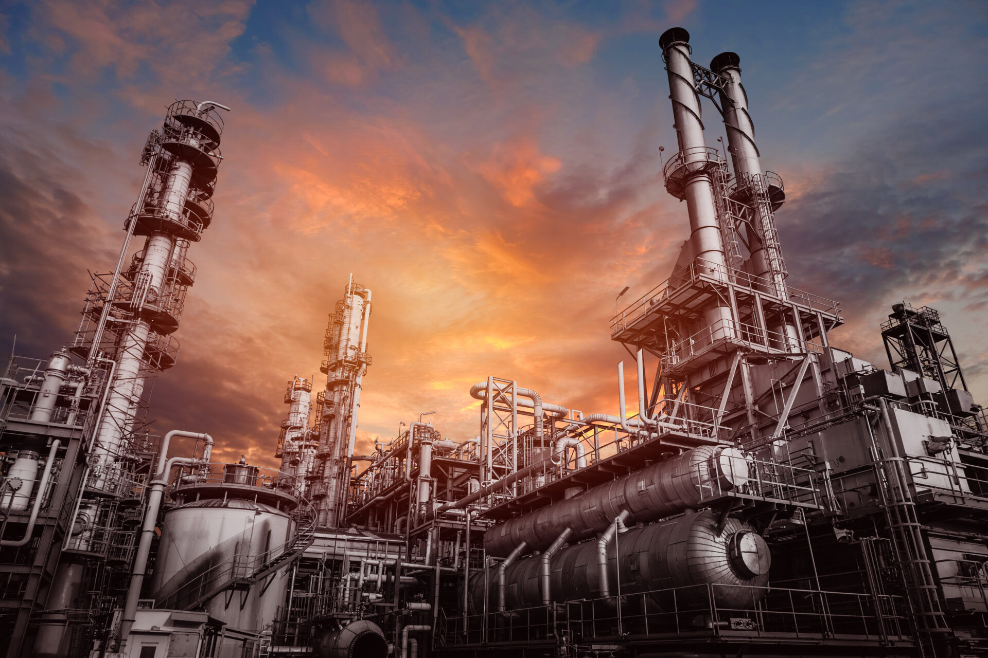 industrial-furnace-and-heat-exchanger-cracking-hydrocarbons-in-factory-on-sky-sunset-close-up-of-equipment-in-petrochemical-plant
